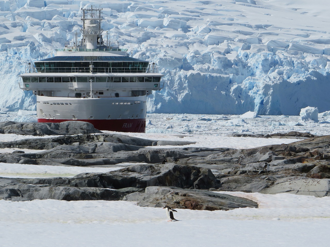 Ship breaking the ice in Antarctica