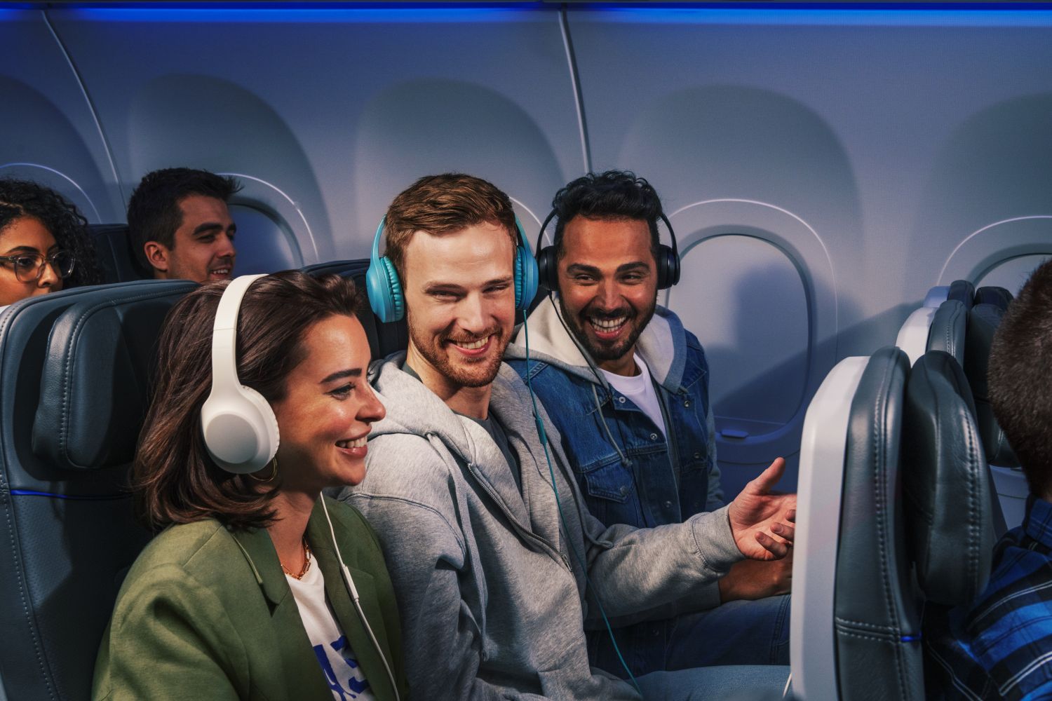 Passengers enjoying seatback entertainment